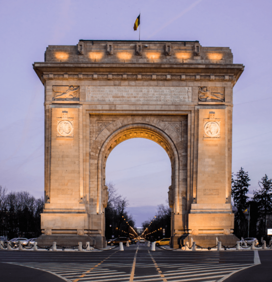 Sunset front view of Arc de Triomphe in Bucharest, Romania